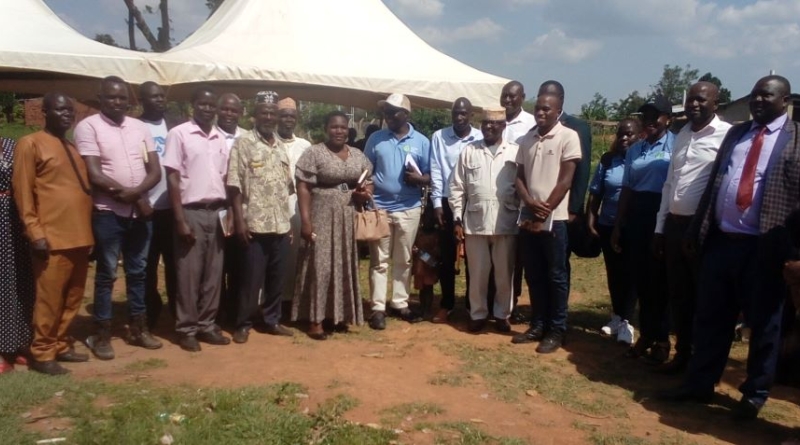 A group photograph capturing attendees after the official commissioning of the solar water supply system in Mitimito village.