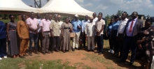 A group photograph capturing attendees after the official commissioning of the solar water supply system in Mitimito village.
