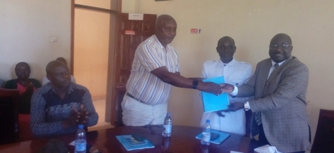 Outgoing District Chairperson (right) handing over office to CAO